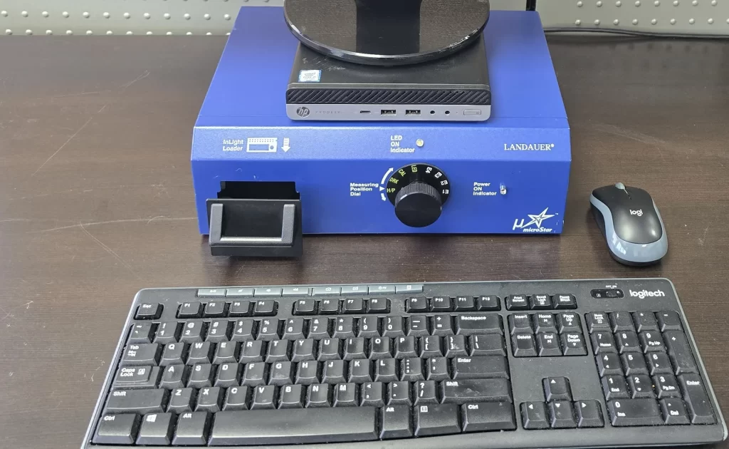 Blue Landauer microSTAR reader with a keyboard and mouse