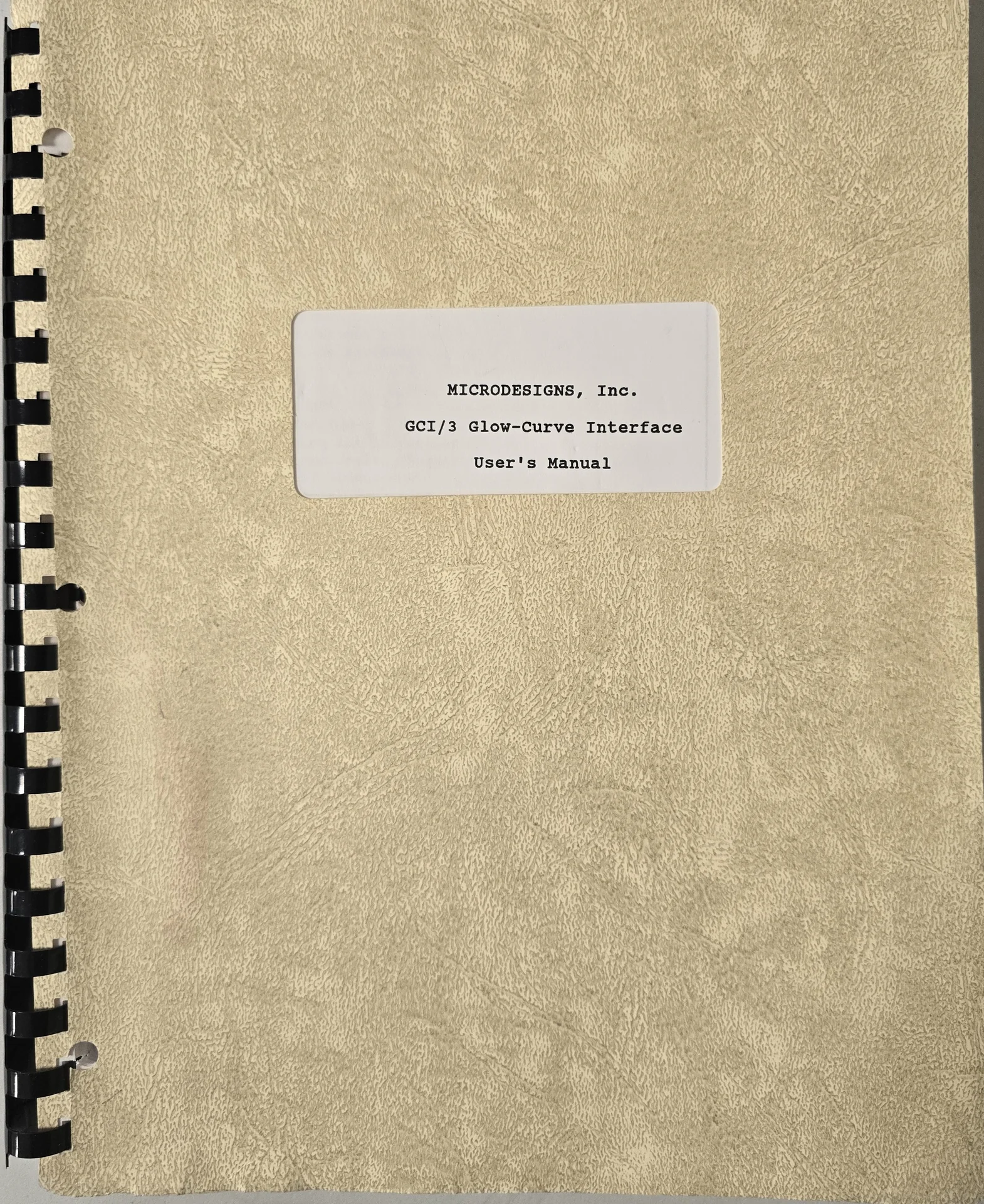 Spiral-bound Micro Designs GCI-3 manual with a beige cover