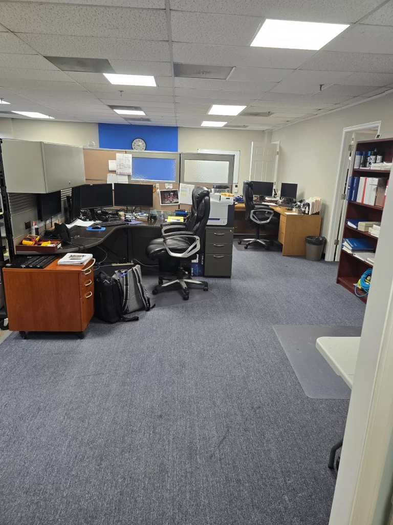 ProxDose technical workspace with desks, equipment and storage shelves