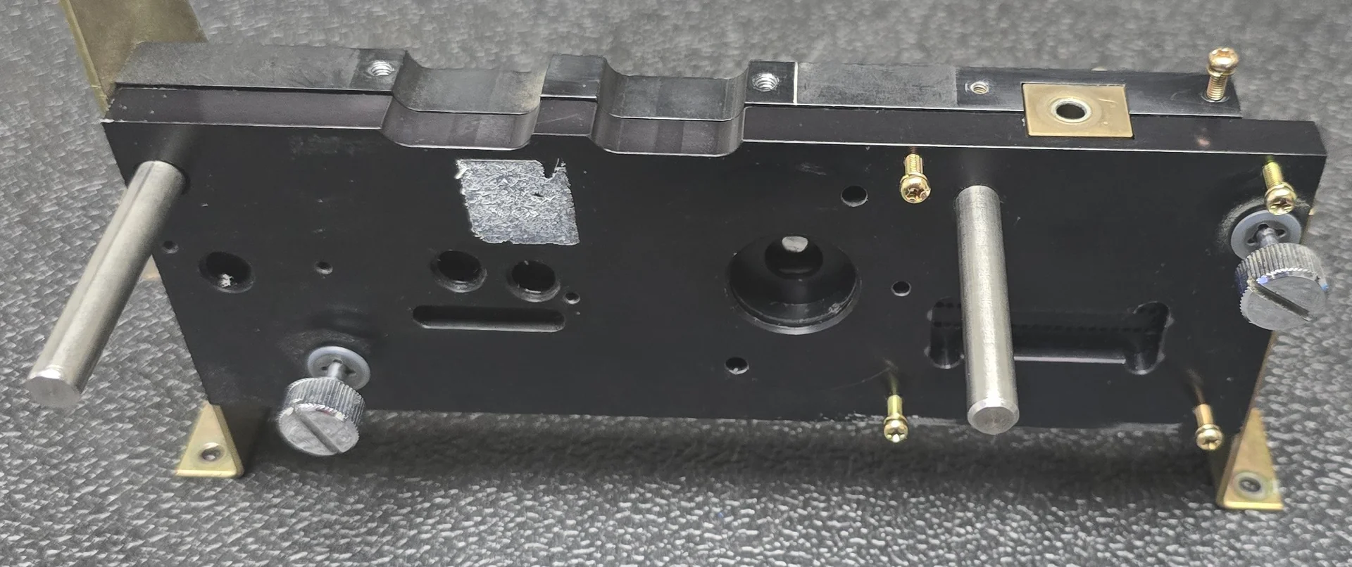 Reader main housing assembly with a black base plate and metal supports